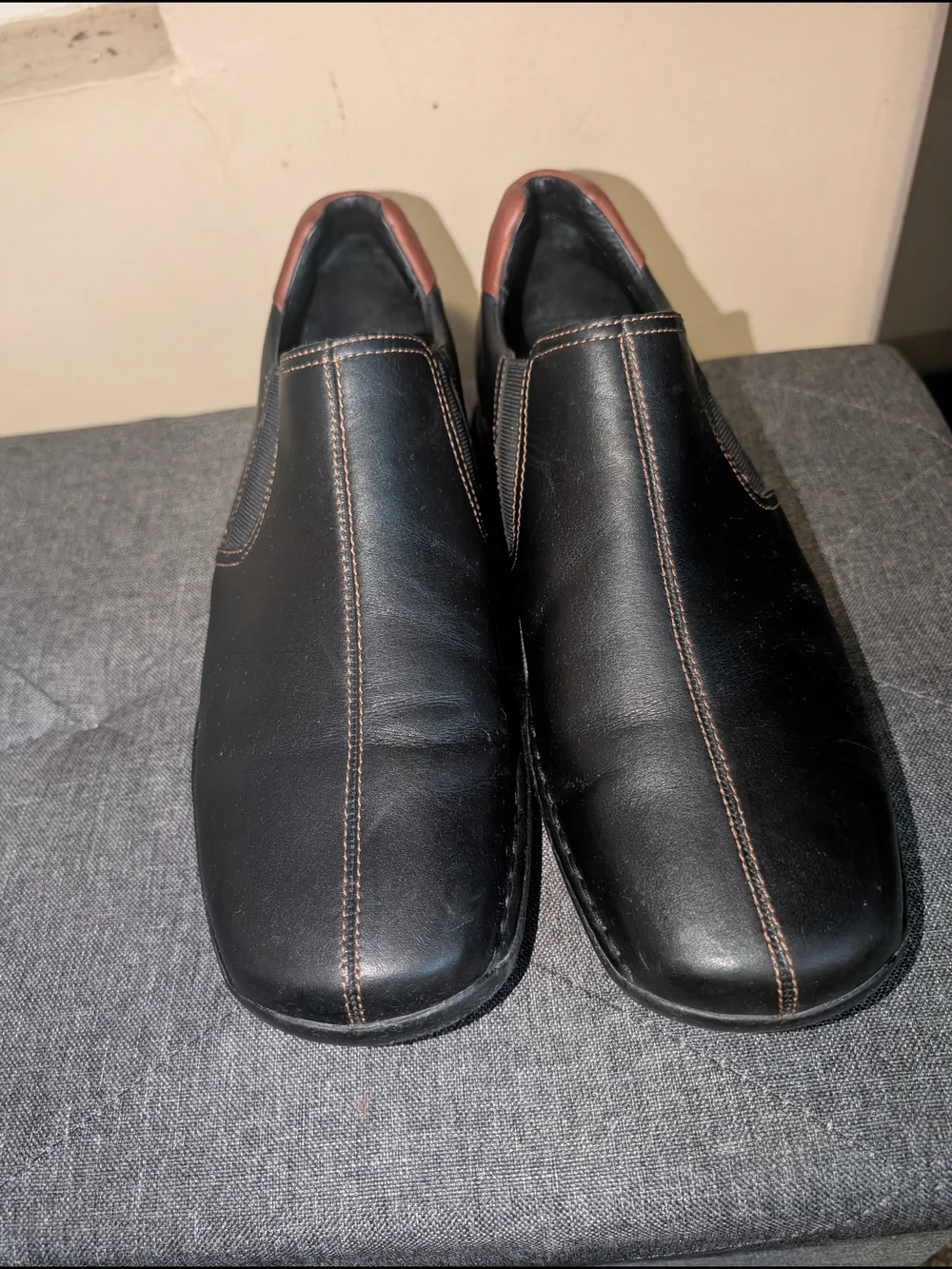 Cole Haan Black Leather Slip-On Loafers with Brown Heel Accent